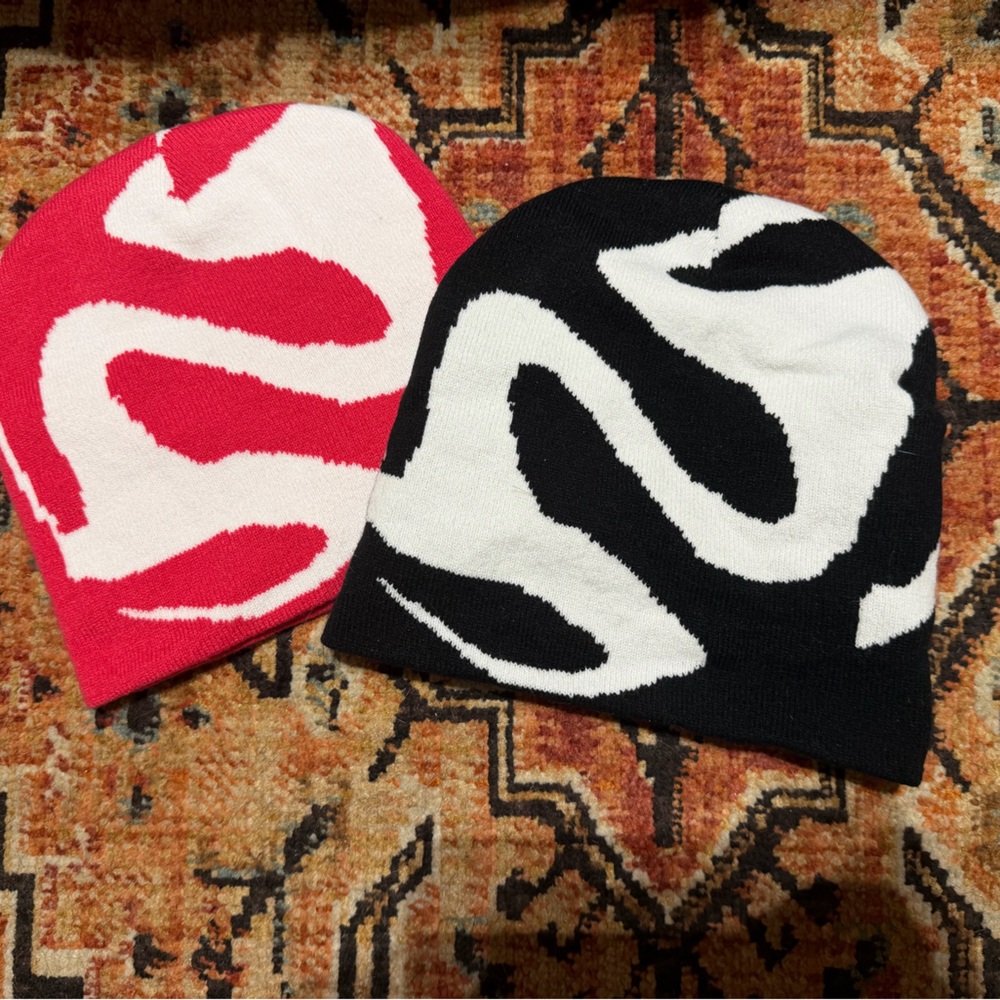 Two Pairs of Pink and and Black Abstract Pattern Beanies